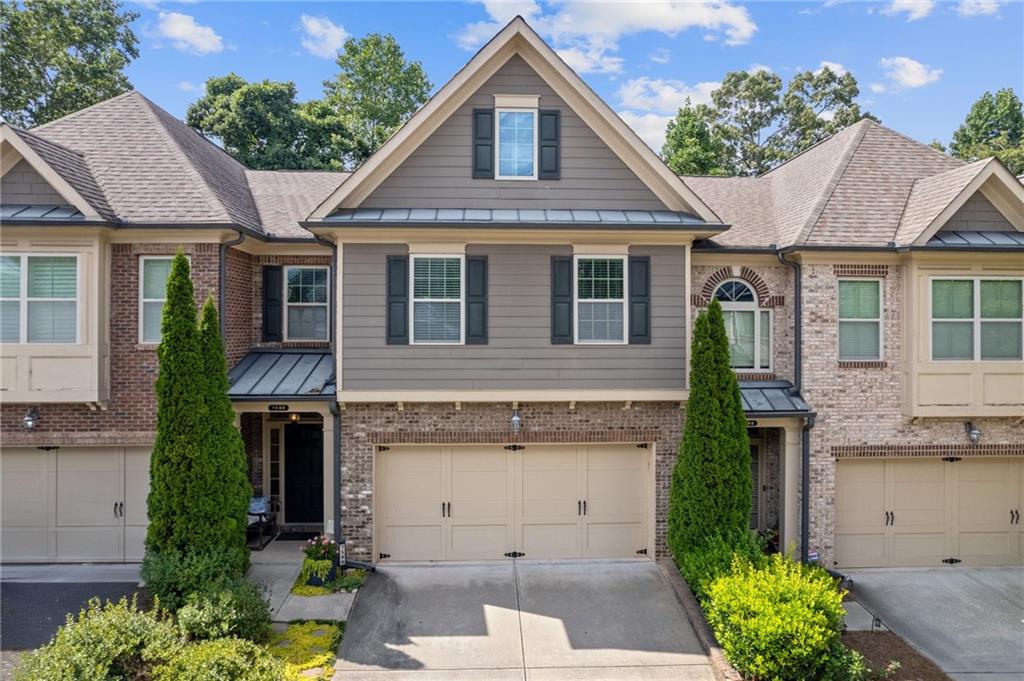 Welcome to the Highlands of Sandy Springs, a charming, gated neighborhood with resort-style amenities in the heart of Sandy Springs. Residents enjoy low-maintenance living with HOA perks that include yard maintenance. This meticulously maintained townhome is freshly painted with neutral colors throughout and offers ample space and comfort. As you step inside, a spacious foyer welcomes you, leading down a hallway to the open-concept kitchen and family room. The chef's kitchen has an oversized island, ample cabinetry, a large pantry, stainless steel appliances, a tile backsplash, and granite countertops. The family room features a cozy gas fireplace with marble surround, creating the ultimate ambiance for relaxing or entertaining. A private patio off the family room is ideal for grilling or unwinding with a cup of coffee or a glass of wine. Upstairs has recently installed luxury vinyl plank flooring in all three bedrooms and the loft area. The over-sized owner's suite bath includes a double vanity, a shower, and a separate soaking tub, leading to large walk-in closet. The secondary bedroom also has a huge walk-in closet. This townhome truly blends convenience with luxury. The neighborhood offers two gated entrances, a pool, gym, dog park, and green space. With easy access to both 400 and 285 and abundant shopping and dining options, this location has it all. You'll be less than 3 miles from Dunwoody Village, Perimeter, central Sandy Springs, and Costco, only 5 miles from downtown Roswell, 10 miles from Buckhead, and 30 miles from the airport.