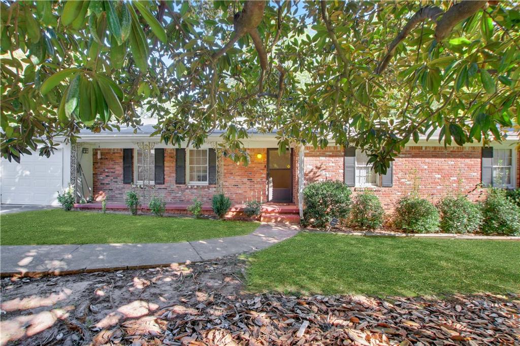 Magnolia Haven: A Renovator's Dream Under the Blossoms.
Unlock the potential of this remarkable property - whether you're dreaming of creating your ideal home, planning a renovation to flip for profit, or looking to generate impressive rental income, the opportunities here are endless! This promising home, featuring a unique magnolia tree that stands as the sole specimen of its kind in the neighborhood, boasts a highly sought-after floor plan. The floorplan features three generous bedrooms, including a serene owner's suite with an ensuite bath, all nestled at the rear of the home for peaceful rest. A corridor gracefully leads you to the front-facing living room, complete with a cozy fireplace, perfect for years of enjoyable and comfortable entertaining.
Enhance the living space by removing the wall separating the living room from the den, creating an expansive area with stunning views through
floor-to-ceiling sliding glass doors that open to the back deck and overlook the sprawling backyard. The home is enviably positioned on a nearly
one-acre lot, offering ample space and privacy.
Situated just off a charming cul-de-sac in a beautifully maintained community, this home enjoys a prime location. It's conveniently close to Interstate 75 for easy city access and near essential amenities like Walmart Supercenter and Home Depot. Don't miss out on this incredible opportunity to make your real estate dreams come true! RV parked on the front parking pad is available as part of the sale for +$10,000.