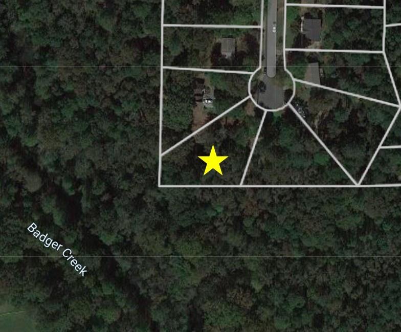 Private Cul-de-sac .63 Acre Lot close to Downtown Woodstock. NO HOA! Bring your builder! Perfect for Basement Floor Plan. Lot is Zoned R-15 and backs up to Corp of Engineer Land. Close to Schools, Shopping, Restaurants, Churches, Parks & Fitness Centers.