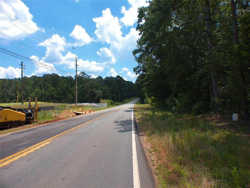 286 feet road frontage on Alcovy Rd and 95 feet on Briarpatch Rd, pond on property, seller is relate to listing agent