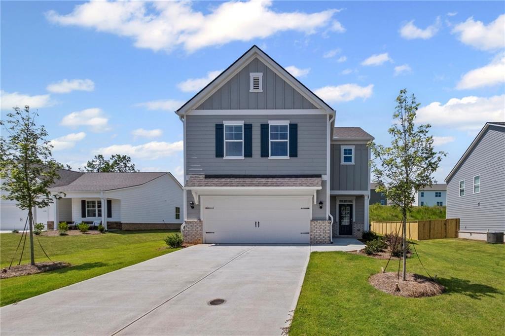 Welcome to 77 Grove Springs Court, a new construction home at Park side at Carter Grove community in the revered Cartersville, GA!
This Elston plan home has a lot to offer in its 2,174 square feet of 4 bedrooms and 2.5 bathrooms. The gorgeous views create the perfect
home for relaxation. Make your way into the foyer from the front porch or two-car garage entrance, and immediately step into the
charming kitchen. The kitchen boasts grey shaker cabinets. Granite countertops, stainless-steel appliances, and walk-in pantry. From the
chef's island, you can overlook into the expansive great room. A powder room is tucked out of the way in the corner of the great room.
Active families can enjoy the durable Rev Wood laminate flooring for easy maintenance. The second level does not disappoint either. A cozy
loft area greets you as you step off the staircase. Two additional bedrooms are directly to the left of the loft area. A hallway on the other
side of the loft area is where you will find the laundry room, a full bathroom with dual vanity, and the third additional bedroom. The
spacious primary suite completes the second level. The primary bedroom features a vast walk-in closet and relaxing private bathroom
including, separate walk-in shower, soaking tub, and dual vanity.