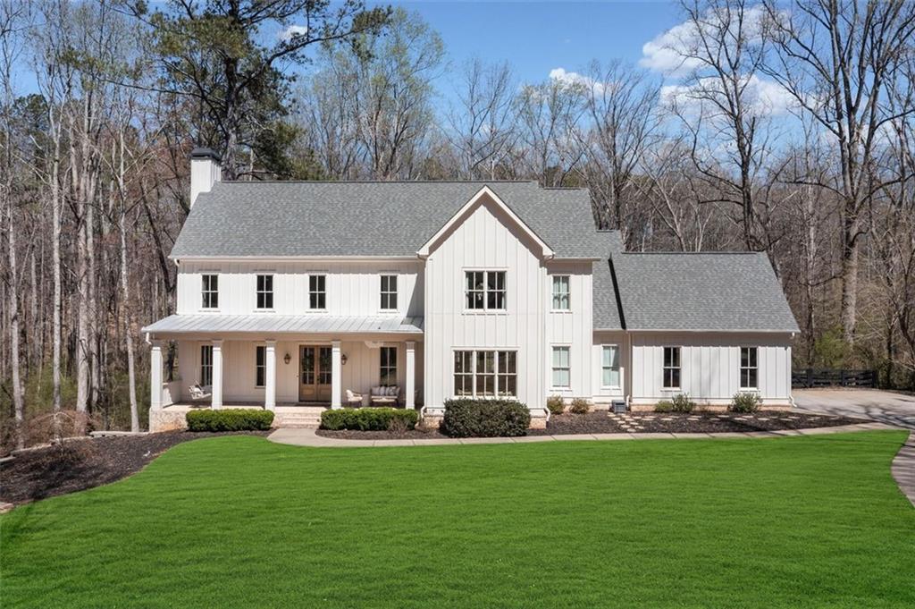 Tucked away on a private cul-de-sac lot in one of Alpharetta's most scenic equestrian enclaves, this beautiful designer appointed 6-bedroom, 5.5-bath estate offers the perfect blend of space, comfort, and quiet sophistication. The location is central to downtown Woodstock, Canton, Alpharetta, and Milton. High ceilings, natural light, and a seamless layout create an inviting flow throughout the home, ideal for both relaxed living and entertaining. At the center of it all is a chef’s kitchen with a 48-inch professional range, custom cabinetry, premium appliances, and an oversized island that brings everyone together. The main-level primary suite is a peaceful retreat with views of the private backyard, a spa-like bath, and a large walk-in closet—designed for comfort, function, and easy one-level living. The finished terrace level adds versatility with two additional bedrooms, generous entertaining areas, and flexible space for a gym, media room, or wine cellar. Upstairs, a bonus room above the garage and a second living area offer even more space to relax, work, or play—all enhanced by the home’s continued high ceilings and open feel. Outside, the expansive backyard provides endless possibilities for outdoor living—whether you envision a pool, garden, or simply the serenity of nature in your own private setting. A rare opportunity to enjoy graceful living in one of the areas most sought-after communities. An Alpharetta address with Cherokee county taxes, and in top rated school districts!