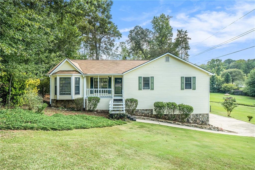 Conveniently located just minutes from I-575, this 3-bedroom, 2-bathroom home in Woodstock offers a spacious layout, updated features, and no HOA restrictions—giving you the freedom to truly make it your own.
All bedrooms are on the main level, including a primary suite with a separate soaking tub and shower, a walk-in closet, and access to a private balcony overlooking the fenced backyard. The updated kitchen features a stainless steel farmhouse sink and a window view into the living room, which boasts vaulted ceilings and a stone-faced fireplace. A separate dining room adds extra versatility to the floor plan.
At the back of the home, a sunroom provides a peaceful space filled with natural light. Downstairs, the basement includes a bonus room, washer & dryer connections, and access to the two-car garage located on the lower level. The covered wood deck off the basement offers another great space for outdoor living.
Enjoy a quiet lifestyle with no HOA, while being close to shops, dining, and commuter routes. This home is a rare find in a great location!
Discounted rate options and no lender fee future refinancing may be available for qualified buyers of this home.