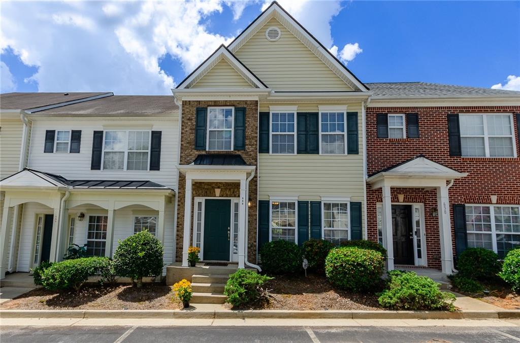 MOVE-IN READY AND APPLIANCES INCLUDED: BUILT-IN MICROWAVE, GAS STOVE, REFRIGERATOR, WASHER AND DRYER!!
Beautifully maintained townhome located in sought-after Gwinnett County with quick access to I-85 and just minutes from Suwanee Town Center Park, shopping, dining, and Lake Lanier. Situated within the desirable Collins Hill School Cluster, this home offers a spacious open-concept layout with 9-foot ceilings and a bright kitchen that overlooks the cozy family room featuring a gas fireplace. Enjoy outdoor living with a private rear patio and a low-maintenance backyard. The upper level features a convenient roommate floor plan with two generously sized bedrooms, each with double closets and en-suite baths. A laundry area is thoughtfully located upstairs for added convenience. Exterior is clad in durable vinyl siding, and the HOA takes care of termite protection, water, trash service, and landscaping, making for hassle-free living. Additional highlights include recent HVAC system and roof upgrades - full of value, DON'T MISS THIS OPPORTUNITY!