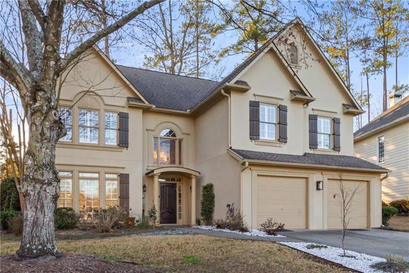 LOCATION! Treat yourself to a new beginning in this beautiful family home, nestled in the serene Turnbury Oaks subdivision of Peachtree Corners. Step into a spectacular dual-story foyer that seamlessly transitions into an open kitchen and light-filled family room with nearly 20-foot ceilings! The front sitting room and attached formal dining room add to the sense of openness, offering the perfect blend of entertainment and functionality. Walk out from the family room to a gorgeous flagstone patio, featuring a private covered seating area. With an included half bathroom, full laundry room, and two-car garage, the main level provides all that you need. Head upstairs into the bright and spacious primary suite, featuring several front-facing windows and an artistically designed tray ceiling. In the primary bathroom, you'll find a unique layout with a separate tub and shower, his-and-hers vanities, and a large walk-in closet. Moving down the hall, you'll find three additional spacious bedrooms, the remaining full bathroom, and a balcony overlooking the open family room. All of this is set within the vibrant and highly sought-after community of Peachtree Corners known for its top-rated schools, thriving tech hub, scenic parks, and walkable Town Center filled with dining, shopping, and seemingly endless entertainment options. Whether you're looking for tranquility, convenience, or a sense of community, this home delivers it all. Don't miss the opportunity to make Turnbury Oaks your next chapter.