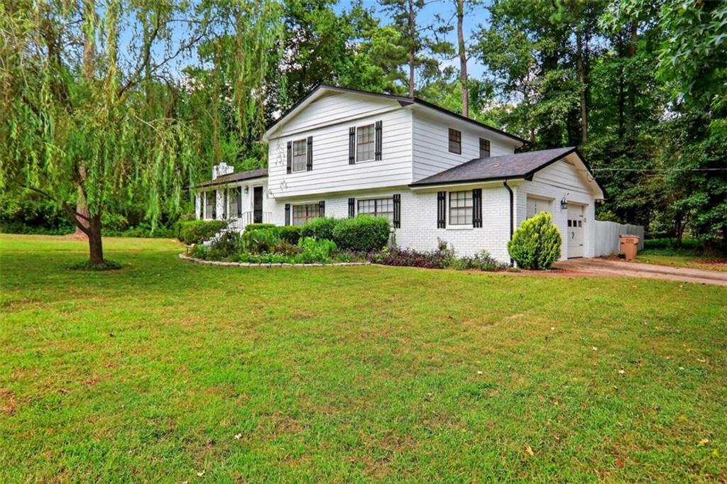 Tucked inside a serene, tree-lined community in sought-after Henry County, this beautifully maintained split-level 3-bedroom, 2.5-bath home is the perfect blend of comfort and convenience. Whether you're a first-time homebuyer or looking to upsize, you'll love the peace and privacy of this quiet, established neighborhood with picture-perfect landscaping and a welcoming atmosphere. Step inside to find a spacious layout designed for modern living and effortless entertaining. The separate living room features a cozy, original fireplace, while the formal dining room-large enough to seat 12-flows seamlessly into the kitchen, making it ideal for gatherings and holiday meals. Downstairs, a bright bonus room with an attached half bath offers endless flexibility-think home office, guest suite, or playroom-with easy access to the private, lush backyard and two-car garage. Community Perks: You're just minutes from top-rated Henry County schools, local parks, golf courses, shopping at South Point and Tanger Outlets, and dining options throughout McDonough, Stockbridge, and Locust Grove. Quick access to I-75 makes commuting a breeze. Bonus: Seller is offering a home warranty for peace of mind and up to $2,500 in lender credit to help with closing costs or rate buy-down. Schedule your showing today-this gem is perfect!