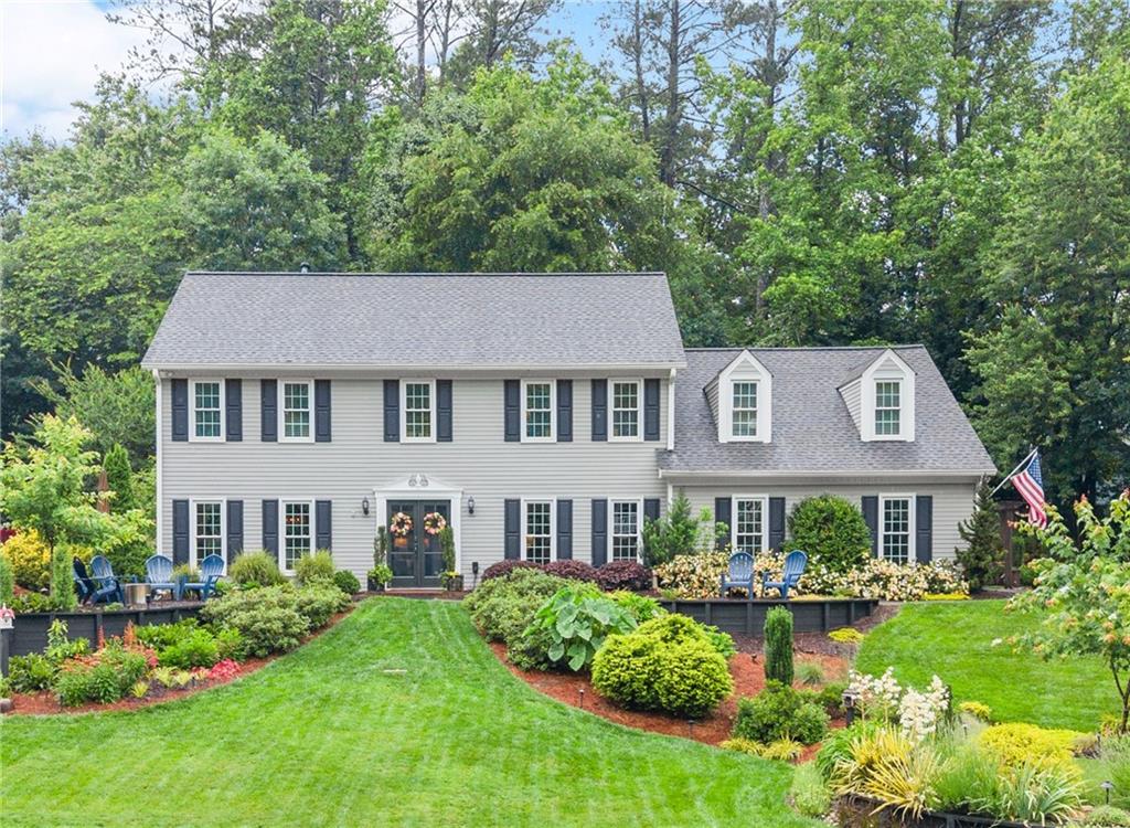 Modern updates, timeless charm, and resort-style living — For the entertainer and those who love to host parties, welcome to 1540 Kinglet Lane! Tucked at the end of a peaceful cul-de-sac in the sought-after Chestnut Springs Swim & Tennis community, this beautifully renovated home is the perfect blend of warmth, elegance, and functionality — with a front yard that’s straight out of a dream. Set on a large, private lot with a sweeping flat front lawn and meticulously designed maintenance-free landscaping, this home was thoughtfully reimagined inside and out. Since 2019, nearly every surface has been touched — from a new architectural roof, siding, windows, and custom landscaping to a complete interior renovation. Inside, enjoy the feel of brand-new thanks to smooth ceilings, fresh paint, and new trim throughout the main level. The floor plan has been opened up to create a modern, airy flow, centered around a stunning custom kitchen by an Ellijay Craftsman — featuring maple cabinetry, quartz countertops, stainless steel appliances (including gas range and fridge), and tons of storage. Flow easily from the kitchen into your choice of gathering spaces — the club-style living room and oversized dining area, the cozy family room with fireplace, or the light-filled sunroom with beamed beadboard ceiling and skylights that make this a true sanctuary. Step outside to your very own resort: a custom-built oversized screened-in porch with a vaulted gable roof, dining and lounging areas. Just beyond is an on-level private landscaped patio. AstroTurf and hardscaping make this space a breeze to maintain, and the professionally lit gardens invite you to linger long after sunset. (And yes — the DogWatch invisible fence is ready for your pups to enjoy it all too.) Upstairs, the primary suite is a retreat, featuring a luxurious soaking tub, gorgeous glass shower, and two walk-in closets — one expanded from the oversized bonus room. You’ll also love the convenient upstairs laundry, moved from the first floor, renovated bathrooms, newer carpet in the secondary bedrooms, and a bonus room perfect for a 5th bedroom, office, or playroom — complete with rear staircase access. Other highlights include: All new Premium laminate flooring throughout the main level, updated fixtures throughout, upgraded insulation + thermal windows = energy efficiency & quiet. Multiple storage options: attic with pulldown stairs, eaves in the bonus room, and a 2-car garage with two closets. And let’s not forget the unbeatable location: just steps from community amenities like the pool, tennis courts, fishing lake, clubhouse, and a tight-knit neighborhood vibe. Zoned for top-tier schools — Kincaid Elementary, Dodgen Middle, and Walton High — this home offers the complete package: style, substance, and serenity. Don’t miss your chance to call 1540 Kinglet Lane home — this one is truly something special.