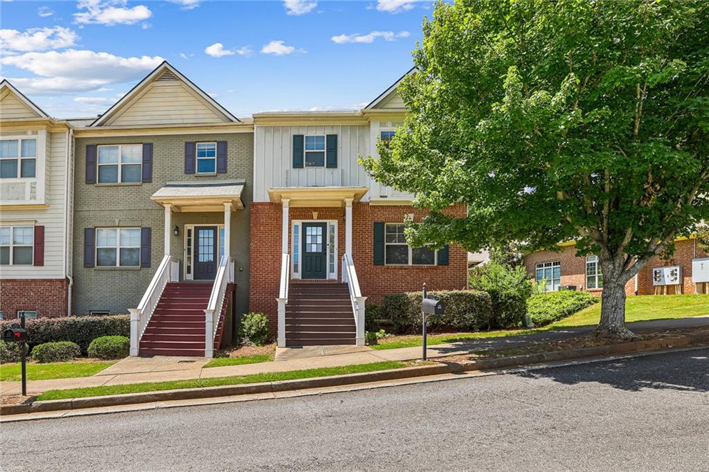 Spacious four bedroom/3.5 bath end unit townhome in a quiet Suwanee community with top-rated schools. Main level features open floor plan with kitchen, family room, fireplace, and patio overlooking a wooded area. Upper level features three bedrooms and two full bath rooms. Lower level has one additional bedroom and one full bathroom. Luxury vinyl plank at main level and basement, plenty of spaces with four bedrooms and 3.5 bath, two car garage. Carpet and LVP floor updated in 2003, new roof approx 2003. Minutes away from I85, shops, parks and restaurants, Sugarloaf Mills (3 miles), Life Time fitness (3 miles), Peachtree Ridge Park(0.9 miles), Assi plaza(5 min). Well maintained and move in ready home, a must see!