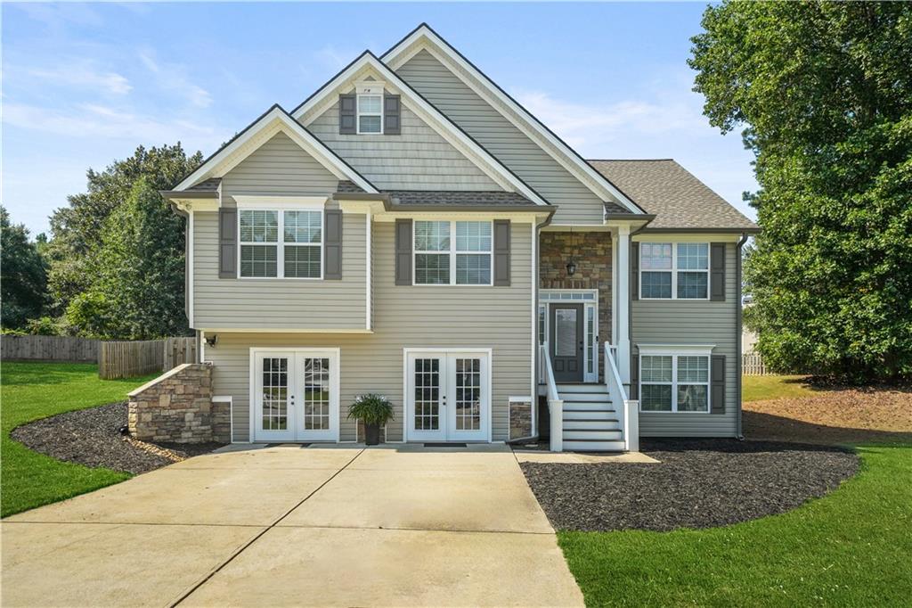 WOW WOW WOW! BETTER THAN NEW! LOCATION LOCATION! Impeccable and meticulously maintained NO HOA home with teen/guest suite and artisanship craftsman upgrades galore located at the Paulding/Cobb line. Main level living features oversized family room with lots of natural light, high vaulted ceilings, arched doorway, recessed lighting, stone gas starter fireplace, separate dining room, breakfast area, beautiful functional kitchen, a spacious primary suite with raised trey ceiling and wainscoting walls, dual vanity sinks, separate shower with separate soaking tub, and walk in closet. Also, on the main are 2 over sized secondary bedrooms, bathroom with double vanity hall bath with closet. IT DOESN'T STOP THERE, step downstairs to the enormous teen/guest suite with immense space in the bedroom with plenty of closet space and its own living room and full bath. BUT WAIT THERE'S MORE, You will also find phenomenal entertainment possibilities with the beautiful finished basement displaying an indoor dry bar and wainscoting walls, french doors, media room, game and billiard room ( billiard table included). Ample storage and large laundry room for ease of chores. WE ARE NOT DONE, No vacation will be needed as you will have your own back yard retreat for dining, entertaining and relaxing on the custom built covered back patio featuring a cedar trimmed wood burning fireplace, ceiling fan, oversized deck for grilling and bird watching in the tree lined backyard oasis. Outbuilding for storage. Double drive for ample parking up to 8 vehicles.