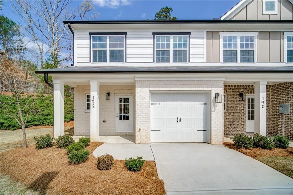 Newer townhouse in Hidden Springs. End Unit with fenced backyard. Step into this beautifully designed home featuring an open-concept layout. The heart of the home is the chef-inspired kitchen, complete with a massive center island that seats several guests and offers plenty of prep space. The seamless flow from the kitchen to the family room makes this home ideal for entertaining. Oversized master bedroom with trey ceiling and master bath. Two spacious secondary bedrooms...one set up for an office. Nice laundry room with washer/dryer and built-in cabinets. Oversized panty, LVP flooring throughout the main, updated trim/lighting/plumbing packages, 12x24 tile in all bathrooms and laundry room, granite countertops, stainless appliances, separate bar area and 9' ceilings on the main makes this home a MUST SEE. Nice size patio with turf grass, fenced, private, and landscaped. This house has it all for a great value. Swim/tennis subdivision. Easy access to I-575, shopping and restaurants.