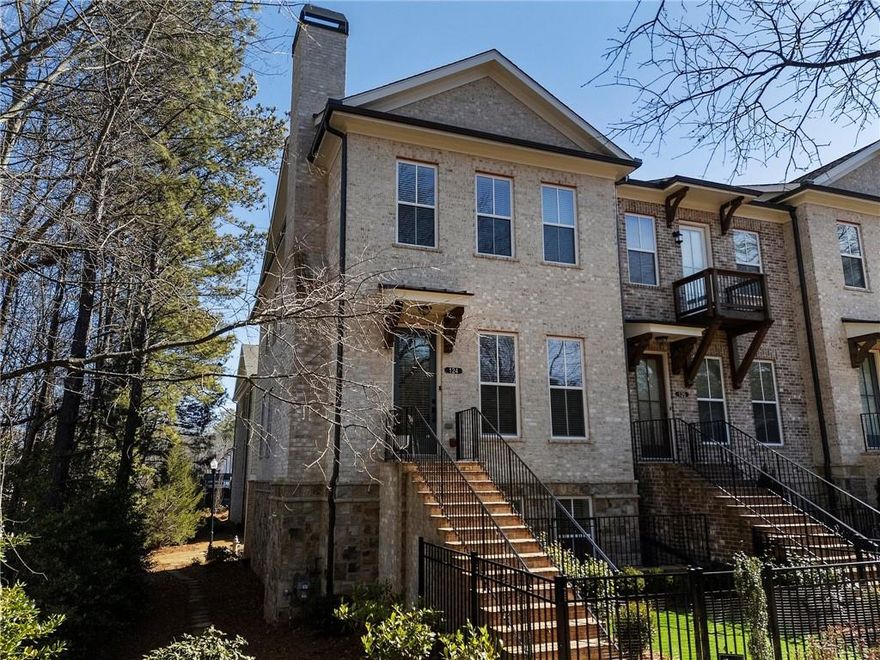 Looking for a newer home near downtown Alpharetta with yard space and upscale features? Welcome to your dream home in Atley—an exceptional gated community with standout amenities just steps from everything Alpharetta has to offer. This stunning Benton II end-unit townhome, built by The Providence Group, offers the perfect blend of style, comfort, and location. Tucked into one of the most desirable spots in the community, this home features a rare fenced, turfed yard—ideal for pets, play, or simply relaxing outside. Enjoy direct access to the Alpha Loop, connecting you effortlessly to downtown Alpharetta’s top restaurants, boutiques, and scenic walking trails. Step inside to find a bright, airy interior with soaring 10-foot ceilings, beautiful hardwood floors, and thoughtful designer touches like brushed gold fixtures. The main level is open and inviting, centered around a gourmet kitchen with upgraded cabinetry, gas cooktop, convection microwave/oven combo, and a large island that flows perfectly into the cozy living area—complete with a shiplap-accented gas fireplace. Whether you’re hosting friends or enjoying a quiet morning, the breakfast area and dedicated office nook off the kitchen (with access to a covered porch!) make everyday living feel effortless. You’ll also find a powder room and laundry area conveniently located on the main floor. Upstairs, retreat to the spacious primary suite, a true sanctuary with a spa-like walk-in shower and generous closet space. Two additional bedrooms share a full bath, offering room for family, guests, or creative use. On the terrace level, discover a private guest suite or flex space with its own en-suite bathroom, walk-in closet, and extra storage—plus a large attic and EV hookup in the garage. As part of the Atley community, you’ll enjoy top-notch amenities: a resort-style pool, dog park, neighborhood garden, and green spaces for gathering or unwinding. And with easy access to GA 400, getting around is a breeze. Luxury, location, and low-maintenance living—all in one unbeatable package. Come see why this home is the perfect fit for your next chapter. Schedule your private showing today!