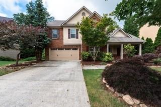 Welcome to this spacious and inviting brick-front home, perfect for comfortable everyday living. The main level features an open family room with a cozy fireplace that flows into the kitchen and dining area, along with a versatile bedroom and full bath. Upstairs, a large loft provides extra space for a second living room, playroom, or home office. The oversized primary suite offers a private retreat with vaulted ceilings, a spa-style bath, and a walk-in closet, while three additional bedrooms and another full bath complete the upper level. Outside, enjoy a fully fenced backyard—ideal for relaxing or entertaining. With plenty of space and a flexible layout, this home is move-in ready and waiting for you!