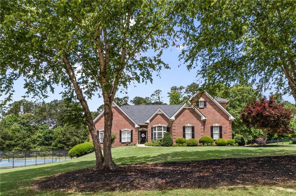 Welcome to this exquisite luxury property in Winder GA, nestled within an acre of beautifully manicured landscapes that exude tranquility and serenity. This lavish estate offers an impressive 4 bedrooms, 3 full bathrooms, and 2 half bathrooms, offering plenty of room for a growing family or hosting visitors.
As you step through the grand entrance, you are greeted by an expansive open-concept living space with high ceilings and floor-to-ceiling windows, providing a seamless blend of indoor and outdoor living. The interior showcases a balance of sophistication and comfort, with high-end finishes, elegant architectural details, and plenty of natural light pouring in to accentuate the sheer beauty of the space.
At the heart of the home, the gourmet kitchen is equipped with state-of-the-art appliances, a large center island, custom cabinetry, and sleek countertops – perfect for the culinary enthusiast. The adjoining dining area is the perfect setting for intimate dinners or entertaining guests.
The home's piece de resistance is undoubtedly the oversized master suite. A sanctuary in itself, the suite is complete with a spa-like en-suite bathroom and a spacious walk-in closet. Each additional bedroom is generously sized, with plenty of closet space and easy access to the luxurious bathrooms.
Head outdoors to your personal oasis where you'll find the pristine PebbleTec gunite inground swimming pool. Whether you’re looking to cool off on a hot summer day or host a poolside soiree, this outdoor paradise promises endless fun and relaxation.
This estate also features an attached garage, providing ample storage space and a safe place for your vehicles. Additional amenities include central heating and cooling systems, smart home technology, and a security system, providing unparalleled comfort and peace of mind. You will also welcome the Generac whole house generator should you experience a power outage. Your neighbors will be your best friend when that happens!
In the full-size terrace level of this home, you'll discover a world of possibilities waiting to be unlocked. Partially finished, this expansive space offers a blank canvas that is ripe for transformation. Whether you envision a home theater, a private gym, or a spacious playroom for the kids, this is the ideal spot to bring your dreams to life.
Moreover, the terrace level houses a third garage, providing a significant advantage for enthusiasts of boating, motorcycling, or simply those in need of substantial storage space. This added amenity ensures you'll never have to worry about the safety and security of your prized possessions. The wide door and high ceilings accommodate larger vehicles with ease, and the convenient driveway access ensures hassle-free maneuvering.
The potential of this lower level is vast and versatile, ready to adapt to your unique lifestyle and needs. Whether you choose to customize it into an entertainment hub, a hobby workshop, or a large storage area, the terrace level adds an invaluable layer of convenience and potential to this stunning home. Imagine the opportunities and make this space your own.
This is more than just a home; it's a lifestyle. It offers the perfect blend of privacy, elegance, and modern convenience. It’s a place where you can escape the hustle and bustle of daily life and retreat to a world of luxury and comfort.
Don't miss this opportunity to claim your piece of paradise. To view the home, ask your Realtor to schedule a ShowingTime tour and prepare to be captivated by the elegance, grandeur, and luxury of this remarkable estate.