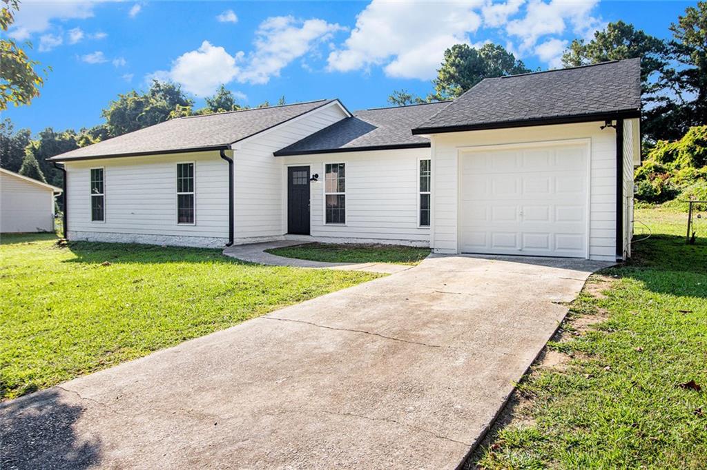 Stunning is an understatement! This 3 BD/ 2 BA home has been completely renovated with the nicest materials and excellent craftsmanship. When you step inside you will find the living room, dining room and kitchen in an open concept. The living room includes a modern electric fireplace with shiplap accents, the kitchen features a beautiful quartz waterfall island, double pantry, all new appliances, beautiful backsplash and farmhouse apron front sink. On the left side of the house you will find the 3 bedrooms, generously sized. The bathrooms have been designed with contemporary finishes and the laundry closet includes new washer and dryer. This home is fully equipped and ready to move in! Give yourself the opportunity to own this unique home!