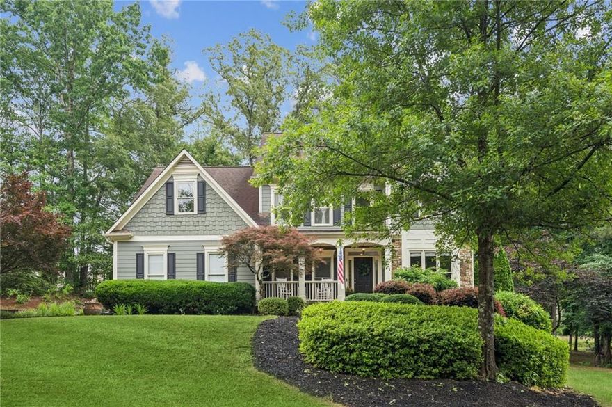 Welcome to 4275 Green Summers Drive – a stunning retreat in the coveted Green Summers community! This beautifully maintained home offers three fully finished levels of exceptional living space, thoughtfully designed for both entertaining and everyday comfort. Nestled in the sought-after Green Summers neighborhood, this property showcases gorgeous curb appeal, a curated yard perfect for all ages, and incredible exterior entertaining areas including a vaulted screened-in porch and open-air deck. Step inside to find rich hardwood flooring, elegant crown molding, and architectural details that elevate each room. The optimal floor plan provides seamless flow between living spaces, while offering an abundance of storage throughout. The kitchen, breakfast room, and living room flow seamlessly in an open-concept layout, with the living room showcasing a stunning stone fireplace flanked by custom built-ins—perfect for cozy gatherings and everyday living. Host holiday gatherings in the beautiful formal dining room and customize the formal flex room into either a beautiful office or formal living room.  The oversized primary suite includes a sitting area, oversized bathroom, dream-worthy walk-in closet for her and a well-appointed closet for him, ideal for those who appreciate both style and space. The fully finished terrace level is perfect for guests or recreation, featuring a media room, bedroom and walk-in closet, full bath, flex space, and even more storage options. Whether you’re hosting gatherings or enjoying a quiet evening at home, this property offers the best in comfort, style, and function. Don’t miss your opportunity to own this exceptional home in one of Cumming’s most desirable communities!