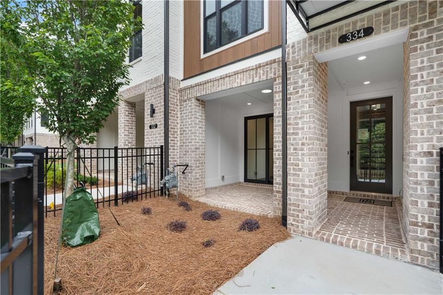 SUMMER OF SAVINGS - $20,000 ANY WAY YOU WANT ON ALL CONTRACTS WRITTEN BY THE END OF JUNE. Come visit us at Ecco Park in Alpharetta & Elevate your lifestyle in this modern, exquisite Barnsley I featuring 2 Bedrooms and 2.5 Baths. This Townhome offers a blend of luxury and functionality, perfect comfortable living. With high end finishes, thoughtful design and outdoor space for entertainment, this home is ideal for buyers seeking style and convenience. Front Entry is private with a fenced Front Yard, Irrigation System and a beautiful Open, Covered Terrace. Front Door entry along opens up to an Flex/Media Room with slider doors to the covered patio, creating the ultimate entertaining space. Take the stairs to the Open Concept Kitchen, Family Room & Dining Area. This gorgeous Kitchen is designed with our Cool Stone Design Package featuring Calacatta Sierra Quartz Countertops, 42" Upper Cabinets with Crown molding and Soft Closing Doors, GE Stainless Steel Appliances, Gas Cooktop, Built in Microwave, Dishwasher and Range Hood. Add some barstools at the L shaped island for casual dining and use the 2nd island for food prep. The family room features a Linear Fireplace with a stunning floor to mantel quartzite surround. Plenty of natural light from the family room windows & glass door that leads to your rear wooden Deck. On the upper floor you will find the perfect space for relaxation with the primary suite. The spacious primary bedroom has a tray ceiling and a luxurious spa like bath. The large tile shower with frameless door, double vanity with marble countertops and walk in shower complete the space. Down the hallway is a secondary bedroom and full bathroom giving everyone their privacy. Location is prime as you can walk to major Shopping Centers, Best Buy, Target, several restaurants, Cava, Lazy Dog, Buffalo's Wings, Cheesecake Factory just to name few. Primary Care and Dentist Office are across the street. One car garage with Electric Charger with more parking space on the Driveway and several unsigned spaces throughout the community.  Virtual Tour is of previously built Barnsley plan. [The Barnsley I]