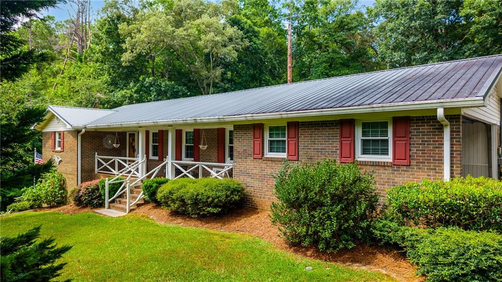 Bremen City! This one has it all beautiful 4.57 acres located on a picture-perfect spot tucked away in its own private setting! Home features 3bedrooms 2 baths on main floor and a large bonus room with half bath in basement (has entry from inside and outside). Could serve as a mother-in-law wing! Wait until you see the amazing Gazebo looking out over the acreage it is a great spot for gatherings or to enjoy your morning coffee! Spacious Sunroom, expansive fenced in patio area! Kitchen feature granite counter tops, wood Cabinetry, stainless steel appliances! Snap/lock flooring! Metal roof! Large laundry room! Fabulous front porch with tranquil view! Several outbuildings & Barn on property! Great area for gardening! All of this and just minutes away from restaurants and downtown! Hurry to see!