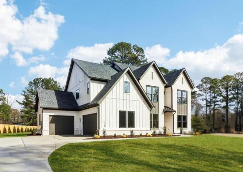 Experience elevated living in this stunning, European-inspired custom-built modern home located walking distance from Lake Lanier and only 3 min from Tidwell Park and Boat Ramp and 4 min from the boat ramp and beach access at Bald Ridge Creek Campground, the Cumming City Center, and top-rated Forsyth County schools. Tucked within a desirable NON HOA community with no covenants or restrictions, this 5-bedroom, 4-bathroom residence also includes a dedicated office and a bonus sitting room/flex space, offering exceptional functionality and flexibility for today's lifestyle.Crafted with luxury in every detail, the home features European-imported finishes, modern French Oak and designer tile flooring throughout, and soaring 10-foot ceilings on the main level. The open-concept living space centers around a sleek gas fireplace with custom built-ins, providing both warmth and contemporary sophistication.The show-stopping chef's kitchen is thoughtfully designed with a waterfall-edge quartz island, premium ZLINE stainless steel appliances, a full quartz backsplash, luxe gold fixtures, and custom European cabinetry. A hidden butler's pantry/prep kitchen with a second sink, additional cabinetry, and appliance storage ensures seamless entertaining and a clean aesthetic.A private main-level guest suite features a custom accent wall, tiled walk-in shower, quartz countertops, and premium gold hardware. Upstairs, you'll find a spacious loft/home office and four oversized bedrooms-all with en suite baths featuring quartz counters, designer tile-work, and curated gold fixtures.The luxurious primary suite offers a spa-inspired retreat with dual vanities, a freestanding soaking tub, a frameless glass walk-in tile shower, a private water closet, and a fully custom walk-in closet with built-in shelving for effortless organization.Enjoy outdoor living on the covered patio overlooking a flat, private backyard-perfect for a future pool or fencing for pets, with one side already pre-fenced for added convenience.Additional features include a 3-car garage, mudroom, energy-efficient systems, and architectural elements and finishes rarely seen in new construction. Every inch of this home was curated with intention, precision, and elegance-offering a truly one-of-a-kind opportunity in one of Cumming's most coveted locations.