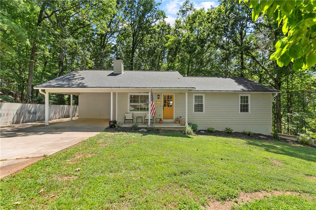 Completely Renovated Ranch on 2+ Acres with Seasonal Lake Views! Welcome to your Pinterest-perfect, move-in-ready dream home! This beautifully renovated ranch sits on a spacious 2+ acre lot and offers the perfect blend of modern updates and serene, country-style living—with no HOA to limit your lifestyle. Inside, you'll find an airy open-concept layout filled with natural light and stylish finishes throughout. The home boasts all-new flooring, fresh interior and exterior paint, designer lighting, and fully renovated bathrooms and kitchen—complete with a walk-in pantry, new appliances, and spacious laundry room. Enjoy peace of mind with brand-new major systems, including a new roof, HVAC, plumbing, a newer hot water heater, and newer windows. A newly built back deck overlooks your fully fenced backyard, offering privacy and space to entertain, play, or garden—plus seasonal views of the lake! The partial unfinished, daylight basement is stubbed for a bathroom and ready for your custom touch—whether you're dreaming of a home gym, media room, or additional living space. With plenty of room to grow, stylish design choices, and turn-key condition, this is the rare kind of home that truly has it all. Don't miss your chance to own a slice of paradise!