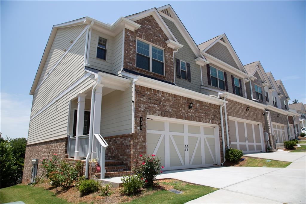 Big!! Beautiful!! East Facing!! Close to Amazing Downtown Woodstock!! End Unit Townhome with Finished Basement offers Incredible Panoramic Views off Private Back Deck and so much more! High End Finishes and Open Floor Plan! Spacious Kitchen includes Granite Island/Breakfast Bar, Gorgeous Granite Counter Tops, Stainless Steel Appliances, 42 inch Cabinets; Totally Open to Lovely Dining Area and Fireside Family Room Space! Absolutely Incredible Views from the Family Room, Dining Area, and All Back Windows! Spacious Master Suite/Bath features Big Walk In Closet, Trey Ceiling, Tiled Shower, Separate Garden Tub, Double Vanities, and more. All bedrooms offer plenty of space! Finished Downstairs/Basement is wide open space! Priced Below Appraisal and Among the Very Few Townhomes in the Community with Finished Basements! Easy access to shopping, and not far from Fabulous Downtown Woodstock! Live the dream lifestyle of elegant and affordable privacy yet near entertainment, restaurants, and more! If you like affordability, luxury, space, scenery, and convenience, this is the perfect place for you!!!