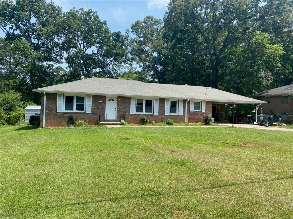 All Brick Ranch in Birchwood Park! 3 Bedrooms, 2 Baths with hardwood floors throughout! Needs some TLC but great bones! 2 Car Carport and oversized backyard! Large Living Room/Dining Room Combination and Den. Backyard is fenced and there is a lot of room to play. Outbuilding for storage. Close to shopping, schools, restaurants and public transportation!