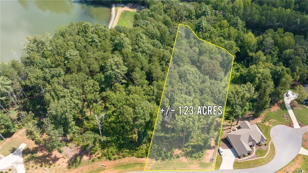 1.23± Acre Lot in the Prestigious Yonah Mountain Lake Community. Welcome to your mountain escape in the sought-after gated community of Yonah Mountain Lake. This expansive 1.23± acre lot offers both privacy and natural beauty, complete with a serene creek running along the entire back property line — the perfect spot to relax and unwind. Enjoy access to the private community lake just up the hill, ideal for fishing, kayaking, and enjoying the peaceful mountain setting. The neighborhood features a gated entrance, a charming pavilion with a stone fireplace, grill, and a dock that extends into the lake — perfect for entertaining or soaking in the views. Nature lovers will appreciate direct access to the National Forest for hiking, and the property’s close proximity to Helen, Cleveland, Unicoi State Park, and all the adventures the North Georgia Mountains have to offer.