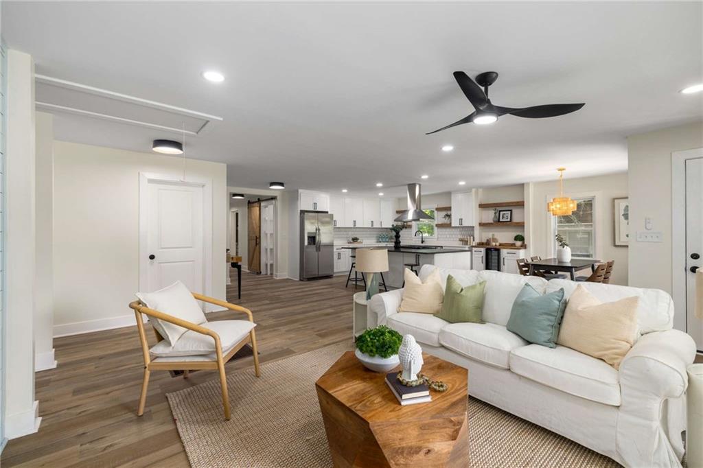 Welcome to 638 Medford Place, a beautifully reimagined 4-bedroom, 3-bathroom home offering over 2,000 square feet of thoughtfully designed living space. Every inch of this home has been updated with modern style and functionality in mind, from the custom lighting and stylish hardware to the sleek, high-end finishes throughout.
Step into an open-concept main living area flooded with natural light, featuring wide-plank luxury flooring, crisp neutral paint, and a designer kitchen that impresses with white shaker cabinetry, quartz counters, a striking backsplash, and stainless steel appliances. The spacious dining area opens seamlessly into the inviting living room—perfect for entertaining or relaxing with family.
The primary suite is a true retreat, complete with vaulted ceilings, dual closets, and private access to the backyard oasis. The en-suite bathroom showcases a spa-like vibe with double vanities, modern matte black fixtures, a soaking tub, and a separate walk-in shower. Three additional bedrooms and two more beautifully appointed bathrooms provide plenty of space for family, guests, or a home office.
Out back, you'll find a massive 331 sq ft covered deck—a show-stopping extension of your living space. With exposed beams and architectural details, it’s the ideal spot for morning coffee, summer BBQs, or cozy evenings under string lights. The large, level fenced backyard is shaded, private, and ready for pets, play, or a garden.
This home is tucked in a quiet pocket of Smyrna, just minutes to Smyrna Market Village, The Battery, and Truist Park. You'll love the easy access to I-285, top-rated schools, dining, shopping, and everything the area has to offer.