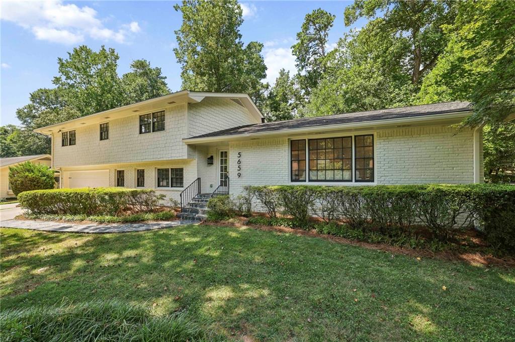 A wonderful offering in popular Mill Glen neighborhood. This great house is located in the award winning Austin Elementary school district. This house offers a very open light and bright floor plan. The gourmet kitchen with stainless steel appliances is very spacious and features quartz countertops. The breakfast area is filled with sunlight and opens onto the deck for easy outdoor entertaining and cook-outs. The kitchen has been opened to the family room/living room area. Hardwood floors are found throughout most of the entire home. The family room/living room is very spacious and offers great natural daylight. In addition to the family room/living room, there is a large informal den on the lower level featuring a fireplace and built-ins. The upper level split features four spacious bedrooms including an extra spacious primary suite. There is a separate laundry room with washer and dryer that remain. The back yard is very large and completely private. Note: brand new AC installed July 2025. If you are looking for a great neighborhood and great house to call home, then 5659 Mill Trace Drive is an offering you do not want to miss out on viewing.