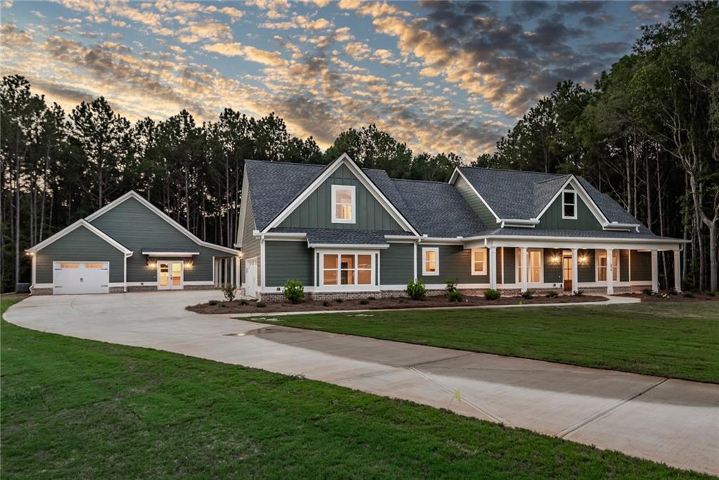 Stunning Home with Guest House on 2.475 Acres in Social Circle! Located on a quiet cul-de-sac just minutes from downtown Monroe and Madison. This property offers the perfect blend of charm, space, and versatility. The main home welcomes you with a large front porch and features an open concept design. A vaulted great room with exposed beams and a brick fireplace flows seamlessly into the dining room and the bright all-white kitchen. The kitchen is equipped with a large island, stainless appliances, wall oven and microwave combo, tile backsplash, and plenty of cabinetry. The main level owner's suite boasts two walk-in closets, a spa-like bath with tiled shower, and dual vanities. An additional guest bedroom and full bath, along with a large laundry room, complete the main floor. Upstairs, you'll find another bedroom, an office, and a spacious loft/flex area. Enjoy outdoor living on the oversized back porch with its own cozy fireplace. The main home also includes a two-car garage. The property's one-bedroom guest house is a rare find, complete with a single-car garage, a large porch, and approx. 800 sq.ft. of private living space-perfect for extended family, guests, or an income opportunity. Sitting on 2.475 beautiful acres, this property combines convenience, privacy, and functionality in one of the most desirable areas of Social Circle.