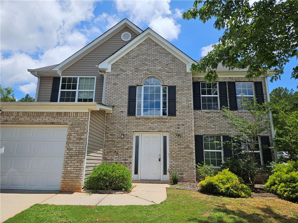 BRAND NEW ROOF, new front door, kitchen appliances and fresh interior paint! Well maintained home on corner lot Tanger Ridge located on Locust Grove Georgia. This brick front home has a tall wooden privacy fence at the back, large rooms and plenty to offer. As soon as you step inside you're greeted by formal two story foyer with views into the living room. Living and dining combo is ideal for entertaining. Kitchen includes stained cabinets, kitchen island, wine rack and tons of storage. Eat in breakfast room overlooks the family room and backyard. Fireside family room has fireplace at the center with plenty of natural light and luxury vinyl plank floors. Primary suite includes tray ceilings, private bath with double vanities and separate tub/shower. Primary suite includes large walk in closet as well! Three more well sized bedrooms make up the second floor and share a full bath. Backyard is fully fenced flat & grassy! Located behind Tanger Mall Outlet, near shopping, restaurants, major highways and more.