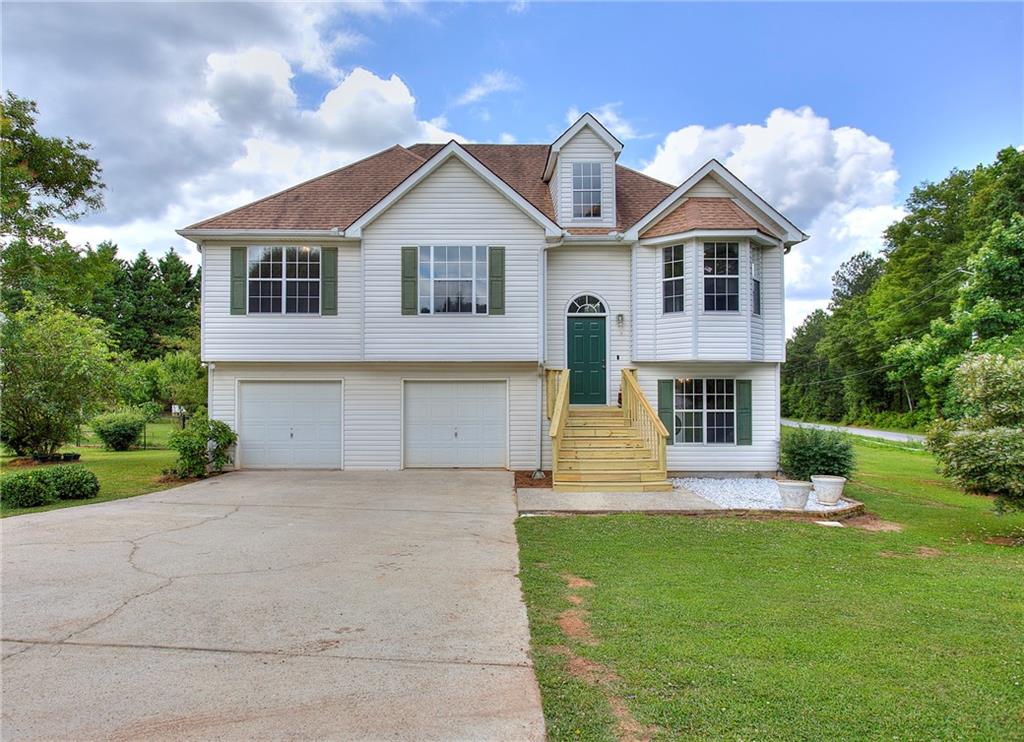 WOW!! Here is your next dream home!! This amazing split level home sits on over half an acre, HUGE corner lot with flat backyard for all your summer fun. This home features NEW PAINT, NEW FLOORS, NEW PORCH AND NEW BACK DECK. Walk into the large open family room that features a great stone fireplace. New celling fans throughout. Downstairs has a Large storage closet. And another HUGE open bedroom with full bathroom that features a STUNNING full tiled walk in shower. Don't miss your chance to get your dream home! USDA 100% financing available.