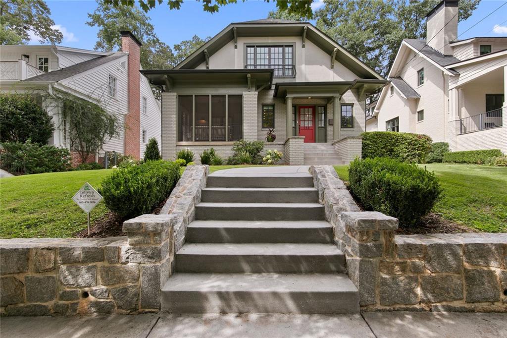 Living on Park Drive is the definition of intown Atlanta luxury—just five doors from Piedmont Park. This 2022 Moon Brothers Inc. renovation reimagines the classic Virginia-Highland bungalow into a magazine-worthy showpiece, seamlessly blending timeless charm with modern sophistication. Step inside to an open-concept floor plan designed around today’s lifestyle, featuring a new main-level primary suite, dual-sided fireplaces with gas starts, soaring exposed beams, and refinished original hardwoods that flow throughout. Every detail has been considered: automatic designer window treatments, custom crown molding, high-end lighting, and walk-in cedar closets for that elevated touch. The chef’s kitchen is a true showstopper—custom cabinetry, striking black granite countertops, exposed brick, an Ilve oven, Monogram refrigerator, Bosch appliances, and a reverse osmosis water filtration system, all anchored by a handcrafted vent hood that feels more like art than utility. Beyond the interiors, this home has undergone a full-scale structural and systems transformation: dual-zoned HVAC, spray foam insulation, whole-house tankless water heater, encapsulated basement, new windows, roof and gutters, new electrical and panel, and more. For effortless living, a reimagined mudroom with custom cabinetry makes laundry as chic as it is functional. The outdoor living is just as remarkable. A screened-in front porch welcomes you, while a new slate back patio and granite stairs lead to a flat grassy backyard—a blank canvas for your pool and garden dreams. A rare double-sided driveway with custom electric gates offers unmatched convenience: pull into your gated carport, unload with ease, and exit forward through the second gate. From the tree-lined sidewalks of Park Drive, stroll to Piedmont Park, the BeltLine, and Virginia-Highland’s beloved restaurants and shops. Few homes offer this level of design, location, and lifestyle—this is intown Atlanta living at its absolute best.