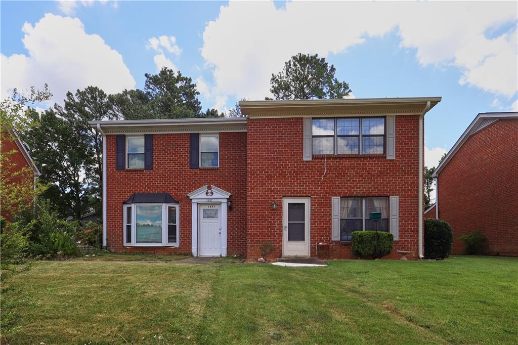 No HOA! Welcome to this beautifully updated 2-bedroom, 2.5-bath end-unit townhome in the heart of Lawrenceville. This three-sided brick home offers 1,340sqft of bright, open living space with wood floors, high ceilings, and a cozy fireplace in the main living area. New Paint, New Carpet and more updates. The kitchen features modern appliances and ample cabinetry—perfect for both casual dining and entertaining. A sunroom just off the living room fills the space with natural light, creating a serene spot to relax or work from home.
Upstairs, you'll find two generously sized bedrooms, each with its own en-suite bath and walk-in closet—ideal for roommates or guests. Located just across from Gwinnett School of Mathematics, Science, and Technology, you’ll enjoy easy access to top-rated Gwinnett schools, shopping, dining, and commuter routes—with no HOA fees to worry about. Whether you're a first-time buyer or investor, this townhome is a smart, stylish choice.