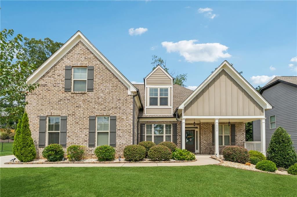 Welcome to this stunning ranch-style home in the highly sought-after Orchard at Mill Creek community, ideally located just minutes from I-85, Chateau Elan, and top-rated Mill Creek schools. This thoughtfully designed residence features 4 spacious bedrooms and 3.5 bathrooms, including a versatile upstairs loft with a full bath, perfect as a fourth bedroom, media room, or home office.
The open-concept layout boasts a seamless flow from the elegant dining area with coffered ceilings to the spacious family room and gourmet kitchen. The kitchen showcases granite countertops, stainless steel appliances, a large island, and a cozy keeping room. This home is ideal for entertaining or relaxing with family. Hardwood floors extend throughout the main living areas, with plush carpet in the bedrooms and tile in all bathrooms.
The oversized owner’s suite is tucked away for privacy and includes direct access to the covered back patio, a luxurious en-suite bath with double vanities, a tiled shower, soaking tub, and a generous walk-in closet. Two secondary bedrooms share a convenient Jack-and-Jill bathroom on the opposite side of the home.
This home also features a stylish mudroom, laundry room with storage, and a side-entry two-car garage. Outside, enjoy the covered patio and level backyard, perfect for outdoor gatherings.