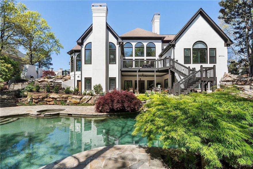 Stunning home and private oasis in Johns Creek's most popular gated, secure community.   Every room in this fabulous floorplan has been updated with beautiful finishes and designer touches.  Video and pictures say it all!   The renovations don't end inside!  The driveway is expanded for additional parking. The pool deck expanded for additional seating and outdoor fireplace to complement the very private refuge in the back.  Or retreat to the private side terrace off the breakfast room with additional outside fireplace and dining area overlooking the pool.  Enjoy main floor living with additional spacious bedroom suites upstairs for guests.  For those guests that are staying longer, they have a completely renovated terrace level that includes a full kitchen, two living areas, laundry, bedroom suite, nursery, and a playroom (or gym if you prefer).  Terrace level is completed with a large wine cellar and walk out to the pool with large, covered patio area to escape the sun.   The main floor offers a large primary suite with beautiful ceiling details, fireplace, doors to the deck, two closets, and a renovated bath that includes soaking tub with heater to keep the water warm!   The kitchen was completely renovated with large waterfall island, abundant storage, walk in pantry, convenient laundry and the high end appliances you expect.   The keeping room and breakfast areas are surrounded by large windows overlooking the beautiful oasis in the back.   Floors, windows, fireplace surrounds, feature walls, interior paint, exterior paint, new bathrooms, new kitchen, and many other enhancements give this home a new construction feel and move in ready!