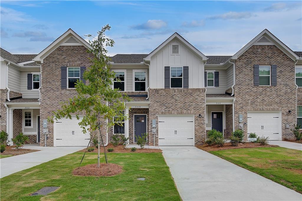 AVAILABLE NOW! Welcome home to our Avery Landing community in sought after McDonough by DRB Homes! No detail is left behind in this beautiful single-family townhome featuring an exquisite exterior. Our spacious Annalise floor plan features 3 bedrooms, 2 full bathrooms. Powder room, a flex room and an open layout on the main level. The stunning kitchen features an island with quartz counter tops and beautiful painted cabinets with a spacious pantry. Upstairs you will find a welcoming owners suite with a sitting area, large walk-in closet, shower, and double sinks. All appliances are included (stainless steel side by side frig., range, microwave, dishwasher and white washer and dryer). One car garage with opener and patio. Photos are of a decorated model.
Please note: If the buyer is represented by a broker/agent, DRB REQUIRES the buyer’s broker/agent to be present during the initial meeting with DRB’s sales personnel to ensure proper representation. If buyer’s broker/agent is not present at initial meeting DRB Group Georgia reserves the right to reduce or remove broker/agent compensation.