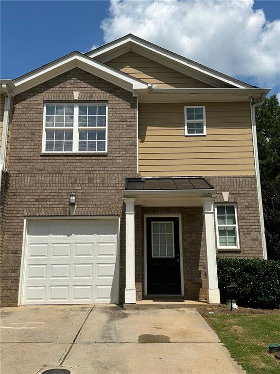 STUNNING townhome for rent with beautifully thought out designs!! Enjoy plenty of natural light in this 3 bed/ 2.5 bath with 1 car garage & driveway big enough for 2 cars. Open concept floor plan, with, stunning light cabinets and silver accents! Hardwoods throughout first level!! Large shower in master bath, double vanity & walk-in closet. Spacious additional bedrooms. Beautiful community in Stone Mountain near shopping and grocery!!