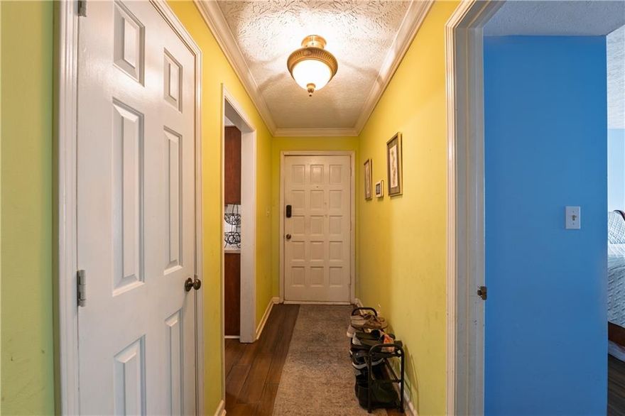 Welcome to this beautifully updated 2-bedroom, 2-bath condo offering comfort, charm, and convenience—all on the ground floor. The renovated kitchen features tile flooring, Corian countertops, a sleek tiled backsplash, updated cabinet fronts, and a pantry for extra storage. Enjoy meals in the separate dining room, then relax in the spacious living area with a cozy painted brick fireplace and large windows that open to a beautifully landscaped patio.

The second bedroom is generously sized and includes access to the front patio, while the updated second bathroom adds a modern touch. The primary suite also opens to the patio and boasts a walk-in closet with built-in organization and a stunning en suite bath complete with an oversized tiled shower, granite counters, and tile flooring.

With newer HVAC and fresh flooring throughout, this home is move-in ready and full of thoughtful updates. Come see it for yourself—you won’t want to leave!