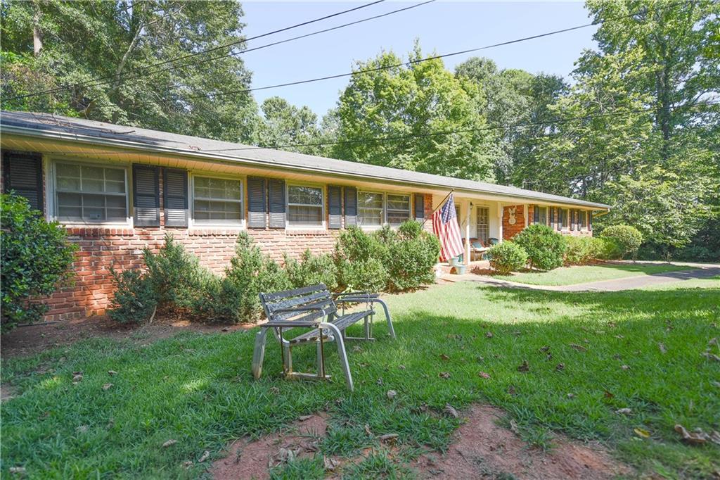 This beautifully maintained one level 4-sided Brick home in the heart of Fairburn offers the perfect blend of space, comfort, and convenience. Nestled on a generous lot, this property features a welcoming front porch, spacious living areas, and a layout designed for both relaxation and entertaining. Enjoy a bright and open floor plan, a well-equipped kitchen, and generously sized bedrooms perfect for families or guests. Step outside to your private backyard oasis-ideal for gatherings, gardening, or simply enjoying the outdoors. Located just minutes from I-85, schools, parks, and shopping, this home combines peaceful living with easy access to everything you need. Don't miss your chance to make 25 Vickers Road your new home sweet home and give the Powell Real Estate Team a call today to schedule your private tour!