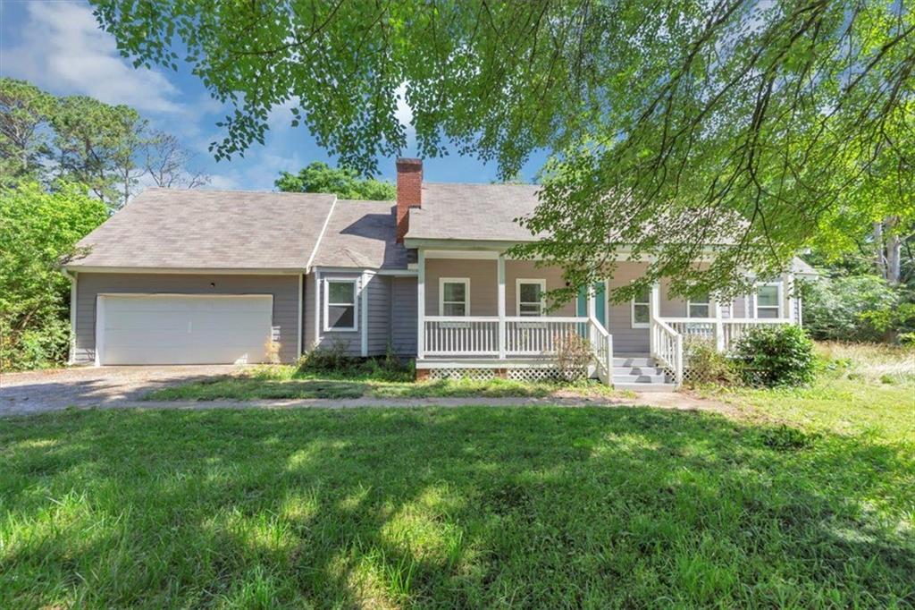 MOTIVATED SELLER! WILL CONTRIBUTE WITH CLOSING COST. This 3 bedroom, 2 full bathrooms home is located on a spacious .84-acre lot and offers great potential. The main-level primary suite provides convenient living, while the upstairs features two additional bedrooms with their own loft/bonus rooms area; Ideal for a home office, playroom, or extra storage. While the home is ready for your personal touch with some cosmetic updates, key improvements have already been made, including a new roof (2020) and a new water heater (2021), providing peace of mind for future owners. HVAC on second floor to be replaced before closing.
Enjoy the expansive yard, perfect for outdoor projects or relaxation.
Sold as is. Conveniently located near Stone Mountain Park, shopping, and highways.