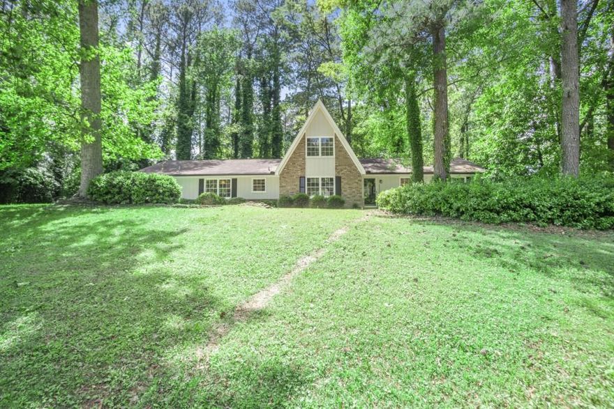 Tucked away on a spacious corner lot in highly sought after East Cobb; this Charming remodeled A-Frame home feels Like a Cozy Ski Lodge! Beautifully updated with 3-bedrooms, and two full baths this charmer blends rustic charm with modern comfort, and the ease of one level living. From the moment you step inside, you'll be greeted by soaring high ceilings, fresh neutral paint, and new flooring throughout, creating an open, airy feel that evokes a warm mountain retreat. The remodeled interior features quartz countertops in the kitchen and bathrooms, complemented by all-new lighting, faucets, and cabinet hardware. The kitchen also boasts a new microwave and dishwasher, perfect for everyday use and entertaining. The versatile upstairs loft can serve as a home office, creative studio, or even a fourth bedroom if needed. Major upgrades include two new HVAC systems, new water heater, and new gutters, offering peace of mind for years to come. *New Fridge/washer/dryer being installed.*The exterior has been freshly painted, giving the home fantastic curb appeal. All new interior paint too! Located in a top-rated school district and priced under $530,000, this home offers exceptional value in an unbeatable East Cobb location. Don't miss this move-in ready gem that perfectly combines lodge-like charm with modern updates! Welcome home!