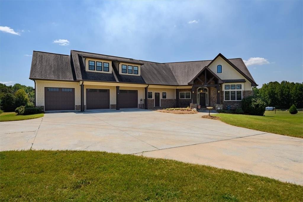 A Rare Find – First Time on the Market!
This gorgeous home sits on 10 acres of picturesque, pastured land, ideal for a mini farm, horses, or anyone seeking the peace of country living with plenty of usable space.
Inside, the open-concept design features a bright living area with soaring beamed ceilings and a spacious custom kitchen complete with a large island – perfect for entertaining and gathering with loved ones. A cozy sunroom opens directly off the living room and leads to the outdoor deck.
The primary suite is a true retreat with private deck access, an extra-large tile bathroom, includes a walk-in shower with built-in bench, custom cabinetry, and a spacious walk-in closet. A second bedroom on the main level, includes a full bath, provides main-level flexibility.
Upstairs, you will find a massive private living space completely stubbed and ready for a second kitchen making it ideal for a teen retreat, guest suite, or in-law suite. This level includes a bedroom with walk in closet, a full bath, and a versatile living space with convenient access to the walk-in attic.
The full unfinished basement offers endless potential, featuring a full-size garage door and two additional entry points. Additional highlights include a central vacuum system, a generous laundry room with built in cabinets, sink and countertop, a 3-car oversized garage with extra storage and direct access to the backyard, plus a Generac generator and underground propane tank.
The land features a creek and plenty of open space that can be fully fenced for animals or recreation.
Words and pictures can’t fully capture this property – it must be seen to be appreciated! Appraisal in documents.