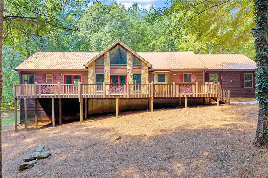Welcome to your own private getaway on 12 acres in the up and coming city of Mansfield! Well-maintained 2 bedroom / 3 bath ranch on a full unfinished basement. There is a finished bathroom in the basement, but remainder is unfinished space that can be used as additional bedrooms, play area, workshop, office, or gym! The large lot allows for endless opportunities - hard to find this much land at this price in today's times! Plenty of natural light with vaulted ceilings in the main living area and floor-to-ceiling windows. Spacious master bedroom with walk-in closet and direct access to your back deck. Master bathroom offers a soaking tub with stand up shower. Enjoy the large, cozy front porch and back deck while you overlook your private and expansive 12 acre lot. Double car garage and long driveway provides ample parking. All systems are in working order. Just a short drive to downtown Mansfield and walking trails or under 20 minutes to downtown Covington. Schedule a tour today to see what all this home has to offer!