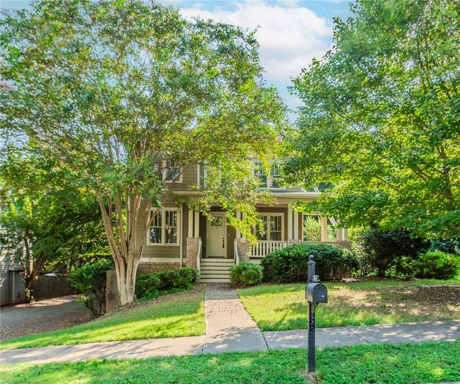 MINUTES TO EMORY UNIVERSITY, 15 MINUTES TO DOWNTOWN ATLANTA AND 25 MINUTES TO HARTSFIELD-JACKSON INTERNATIONAL AIRPORT *CHARMING WRAP-AROUND FRONT PORCH *HARDWOOD FLOORS THROUGHOUT MAIN *LARGE FAMILY ROOM WITH COFFERED CEILING, TWO BUILT-IN BOOKCASES, GAS LOG FIREPLACE AND OPEN VIEW TO THE KITCHEN *GOURMET KITCHEN WITH BREAKFAST BAR ISLAND, GRANITE COUNTERS, TILED BACKSPLASH, STAINLESS STEEL APPLIANCES AND BREAKFAST ROOM *FORMAL DINING ROOM WITH BUTLER'S PANTRY *MAIN LEVEL GUEST BEDROOM WITH ENSUITE *UPPER LEVEL PRIMARY SUITE WITH DOUBLE TRAY CEILING *PRIMARY ENSUITE WITH DUAL VANITIES, JETTED TUB, OVERSIZED WALK-IN SHOWER AND WALK-IN CLOSET *2 GENEROUSLY SIZED SECONDARY BEDROOMS JOINED BY A FULL BATHROOM *UNFINISHED, DAYLIGHT BASEMENT WITH PRIVATE ENTRANCE, STUBBED FOR BATHROOM OFFERS TONS OF STORAGE SPACE AND ROOM FOR EXPANSION *COVERED BACK DECK *2 CAR GARAGE WITH AMPLE DRIVEWAY PARKING *NO HOA