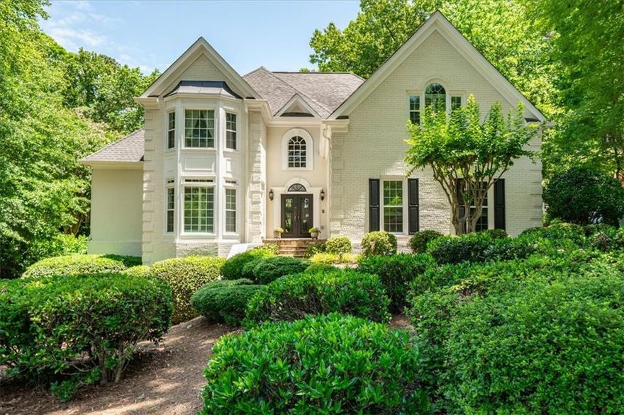 Welcome to effortless luxury in one of East Cobb’s most desirable enclaves. This meticulously maintained Oyster White brick home offers timeless elegance, modern convenience, and the kind of thoughtful upgrades that discerning buyers truly appreciate. From the moment you step through the custom iron double entry doors, you’ll feel the quality and care that has gone into every inch of this residence.

Enjoy main-level living with a spacious owner’s suite that features a renovated bathroom, complete with travertine floors, marble counters, and custom cabinetry. The open and airy layout flows seamlessly from the elegant curved staircase in the foyer to a soaring great room, private office, and gracious dining room—perfect for hosting intimate dinners or holiday gatherings.

At the heart of the home is a showstopping chef’s kitchen, outfitted with top-tier custom cabinetry, a GE Monogram built-in refrigerator, Dacor double ovens, a 6-burner gas cooktop, warming drawer, granite counters, and an oversized island ideal for casual entertaining. Just off the kitchen, a peaceful slate-floored screen porch invites you to savor your morning coffee or evening wine.

Upstairs, you'll find beautifully updated bedrooms and bathrooms (one bedroom is the size of a master suite!) with designer finishes and custom storage solutions. The terrace level offers the perfect blend of function and fun, featuring a full bar with SubZero fridge/freezer, wine cellar, billiards/game room, gas fireplace with stone surround, 3 flexible rooms for guests or 2 home offices and a private covered and weather-protected patio.

Additional highlights include upgraded triple-pane windows, a recently replaced roof, newer HVAC systems (3 total), a replaced driveway, and even a garage with a gleaming granite-finish floor. Don't miss the walk-in storage upstairs!  All of this nestled on a culdesac street in beautiful Sentinel Lake which is a short drive to shopping and I-75.  There are truly too many upgrades and benefits to list—you simply must see it in person!

Ready for a home that lives as beautifully as it looks? Schedule your private showing today and discover why this East Cobb gem is the perfect fit for your next season of life.