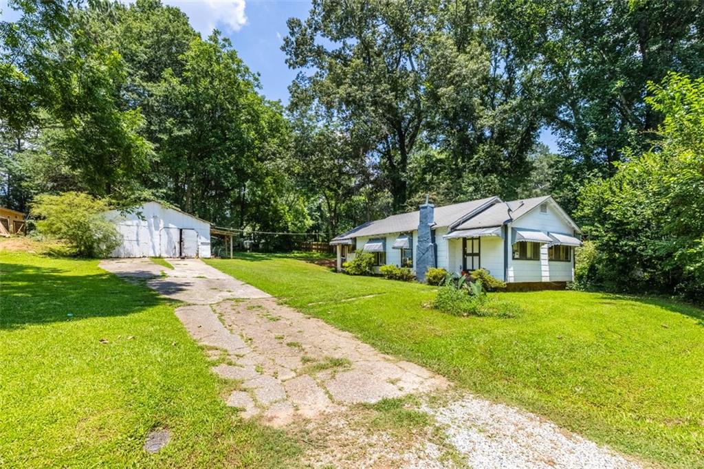 Just south of East Atlanta, this one story Starlight Heights home delivers strong investment returns and would be a solid addition to your property portfolio. Sitting on nearly an acre of land, savvy investors can explore adding additional square footage, building an ADU, or converting the detached 2 car garage. Located just minutes from all the shops, bars and restaurants in The East Atlanta Village, easy access to local parks and trails and close to The Starlight Drive-In theatre. This property is delivered tenant occupied for immediate investment returns.