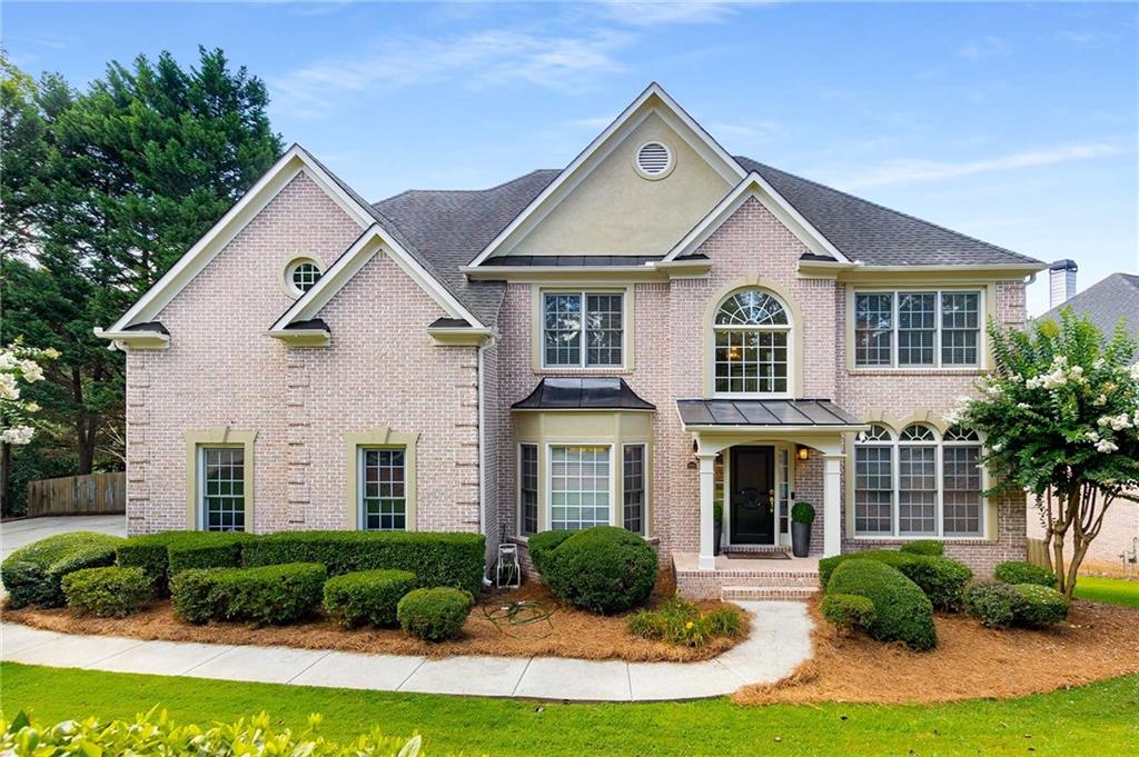 Stately 4-Sided Brick Home with Resort-Style Pool in Mableton
This beautifully maintained 6-bedroom, 4.5-bathroom estate offers luxurious living just minutes from Smyrna. The grand entry welcomes you with an open floor plan, gleaming hardwood floors, and elegant details like crown molding, columns, and tray ceilings. The formal living and dining rooms exude sophistication, while a dedicated office provides a quiet workspace.
The heart of the home is the stunning family room, featuring a marble-surround fireplace, built-ins, and soaring 20-foot ceilings with half-moon windows that flood the space with natural light. The gourmet kitchen boasts white cabinetry, granite countertops, stainless steel appliances, a breakfast bar, and a walk-in pantry—plus a brand-new double convection oven. A charming pass-through connects the kitchen to the cozy sunroom (with its own fireplace) and living room, making entertaining effortless.
Upstairs, the spacious primary suite impresses with vaulted ceilings, a double vanity, two walk-in closets, and a relaxing gas fireplace. Three additional bedrooms and well-appointed bathrooms complete the upper level.
The fully finished basement is an entertainer’s dream, featuring two extra bedrooms, a full bathroom, and a flexible open space with a kitchenette—perfect for hosting poolside gatherings. Step outside to your private, resort-like backyard with a sparkling pool and spa (recently updated with new equipment), a brand-new deck, and professional landscaping.
Prime Location Near Smyrna’s Best Amenities
Enjoy easy access to Smyrna’s vibrant lifestyle, from the annual Taste of Smyrna festival to bustling shopping districts and diverse dining. Outdoor enthusiasts will love the nearby parks, trails, and the Silver Comet Trail, while city attractions like Truist Park, Georgia Aquarium, and Six Flags Over Georgia are just a short drive away. Downtown Smyrna’s Market Village and Village Green—home to the library, arboretum, and community events—add to the area’s charm.
With fresh interior and exterior paint, updated HVAC systems, and a water heater under five years old, this move-in-ready home blends elegance, comfort, and convenience. Don’t miss your chance to own this exceptional property!