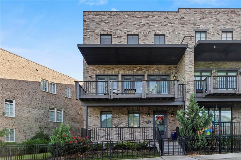 Welcome home to this beautifully designed end-unit townhome in highly coveted Westside Station, where modern design meets comfortable, family-friendly living.
Natural light fills every corner of this 4-bedroom, 3.5-bath home, highlighting hardwood floors, quartz countertops, and designer finishes throughout. The versatile entry-level suite with a full bath offers the perfect setup for guests, a private home office, or a 4th bedroom.
Upstairs, the open-concept main level is the heart of the home—featuring a spacious kitchen with an oversized island, dining area, and inviting living space that flows seamlessly to the covered deck for effortless indoor-outdoor entertaining.
The top floor hosts the serene primary suite with a walk-in closet and dual vanities, plus two additional bedrooms and a full bath—ideal for family, guests, or a growing household.
This particular townhome has the largest fenced side yard in the community.
Enjoy the convenience of an EV charging station in the garage and the charm of a vibrant community offering a pool, clubhouse, playground and green space. With direct access to the Whetstone Creek trail and the BeltLine, Westside Village, and Atlanta’s best dining and retail, this home combines the ease of townhome living with the lifestyle you’ve been looking for.