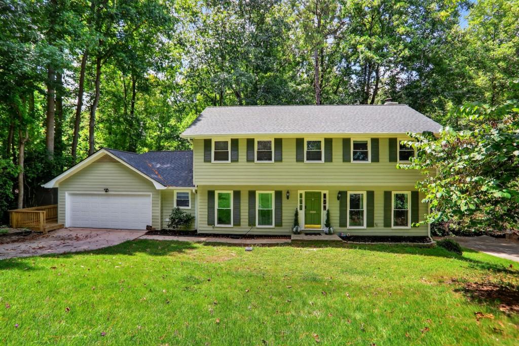 Welcome to your dream home in the highly sought-after Martin's Landing community! This 4-bedroom, 3.5-bath residence offers exceptional living space, modern upgrades, and timeless charm. Step inside to find a separate dining room, a fully renovated kitchen featuring a farmhouse sink, ceiling-mounted vent hood, kitchen island and a cozy breakfast area. The spacious layout includes a large sitting area or office, and a family room with built-in bookshelves, perfect for relaxing or entertaining. Enjoy the natural light in the expansive sunroom, boasting elevated ceilings and walls of windows. Step outside to a brand-new, multi-level deck that wraps around to the front of the home ideal for outdoor gatherings and serene mornings. The finished basement includes a full bathroom and walkout access to the lower deck, offering great potential for a guest suite, media room, or home gym. Additional highlights include brand New roof. Nestled along the scenic Chattahoochee River, Martin's Landing offers an unparalleled lifestyle in the heart of nature. As a resident, you'll enjoy access to three sparkling swimming pools, 13 tennis courts including two premium clay courts and six pickleball courts, perfect for active living. Explore miles of picturesque walking trails, or spend your afternoons kayaking and fishing on the private community lake