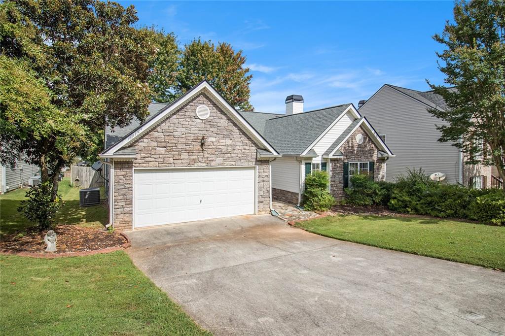 Move-in ready, step-less ranch in a great swim community. This home features a family room with vaulted ceiling and stacked stone, gas fireplace. The dining area is open to the family room and offers additional space to entertain family and friends. The eat-in kitchen has corian countertops, stained cabinets, island and stainless appliances including the refrigerator. The home also features a split bedroom plan. The primary suite boasts hardwood flooring, large walk-in closet and bath with separate tub and shower. Enjoy walks in the neighborhood or late afternoon swims in the community pool The neighborhood also features a playground and pavilion. This home is situated in a small community convenient to I-20, downtown Villa Rica, shopping and restaurants. You will love the shady backyard with patio and mature trees. So much to love about this home.